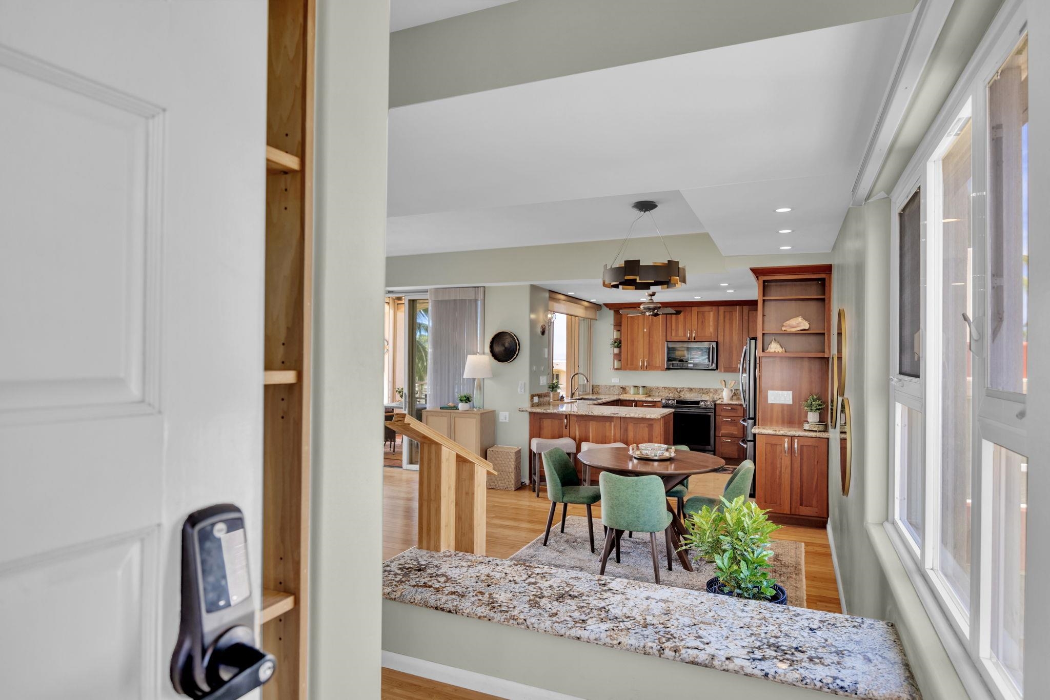3150 Wailea Alanui Drive, Unit 2504 Kihei, HI 96753 - Photo 4 of 47 a living room with furniture and a chandelier