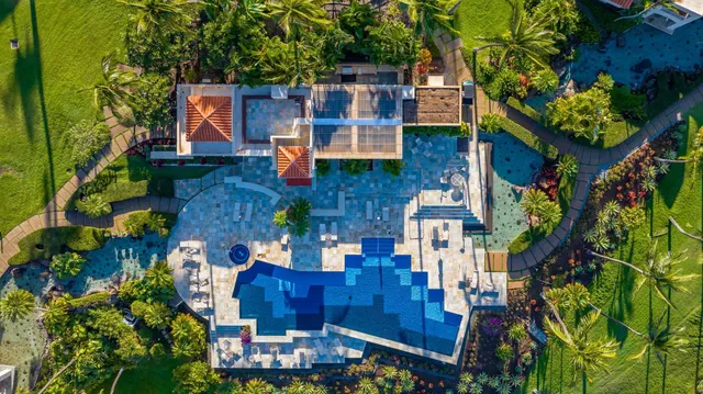an aerial view of multiple houses with yard