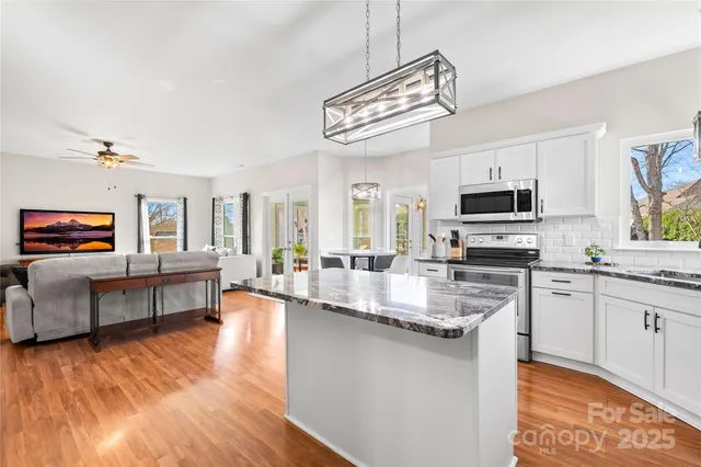 a view of a livingroom with furniture and windows