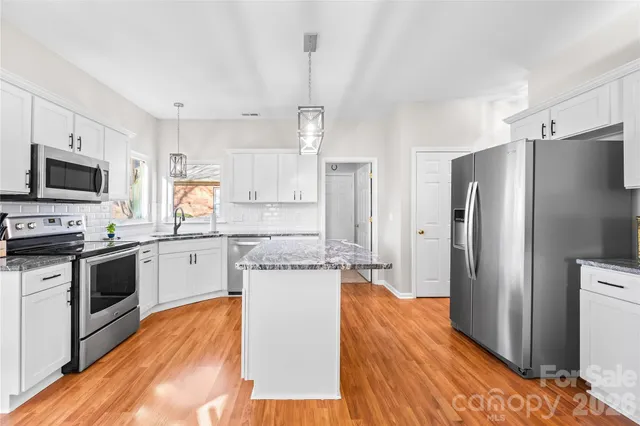 a living room with furniture rug and window