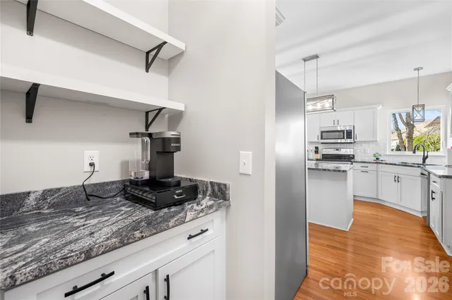a view of a livingroom with furniture and windows