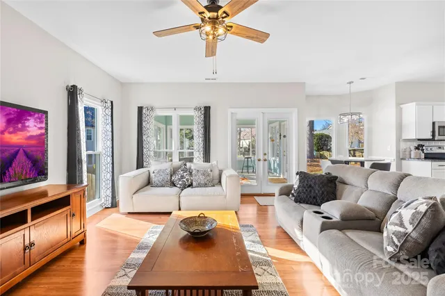 a bedroom with a bed and a dresser with mirror