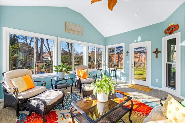 a view of a patio with table and chairs and potted plants