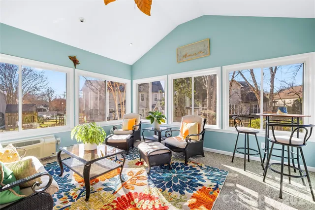 a bedroom with a bed and a dresser with mirror