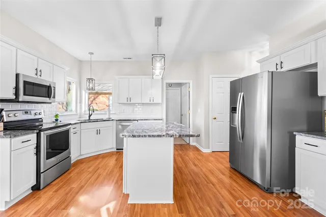 a living room with furniture rug and window