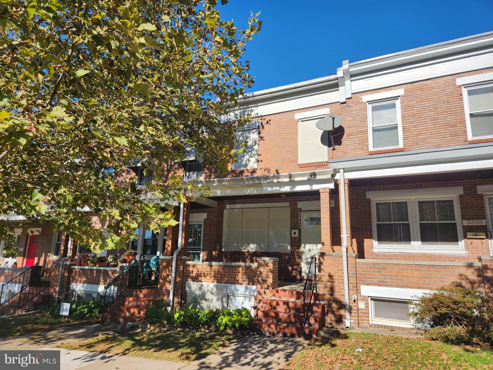 a view of a house with a tree