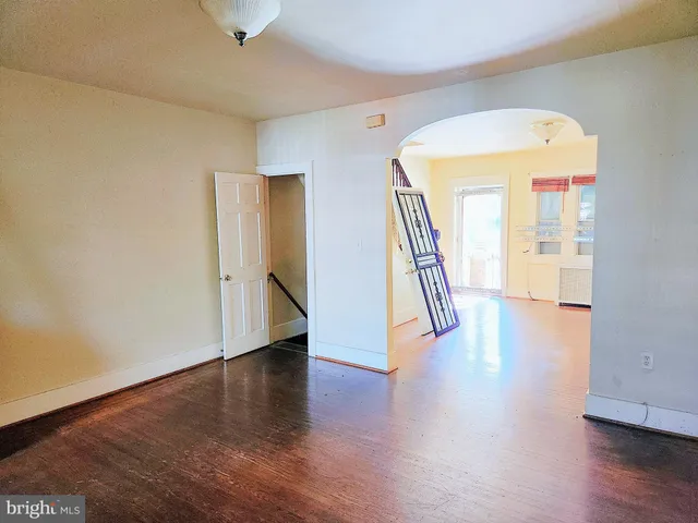 a view of an entryway with wooden floor