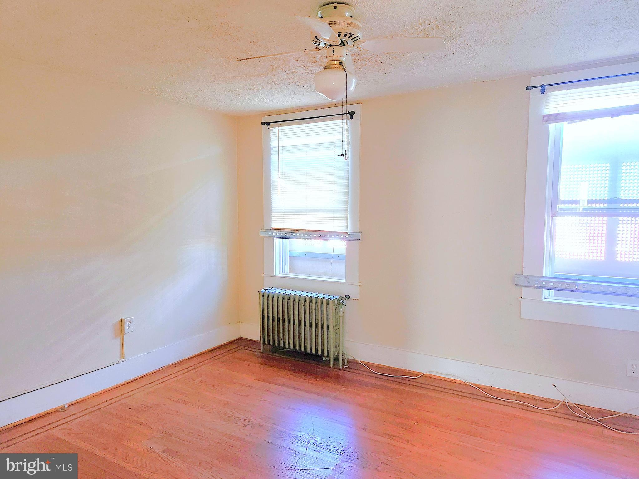 3336 Chesterfield Avenue Baltimore, MD 21213 - Photo 6 of 16 an empty room with windows