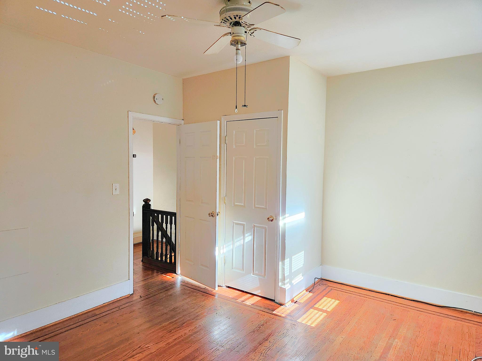 3336 Chesterfield Avenue Baltimore, MD 21213 - Photo 9 of 16 a view of an empty room with wooden floor