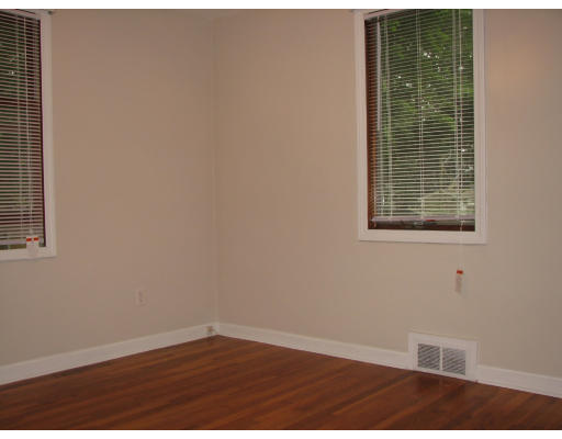 168 Woodcrest Road Springfield, MA 01129 - Photo 11 of 13 a view of an empty room with wooden floor and a window