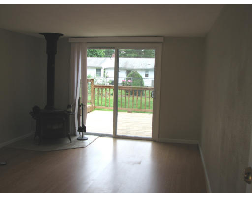 168 Woodcrest Road Springfield, MA 01129 - Photo 4 of 13 a view of an empty room with wooden floor and a window