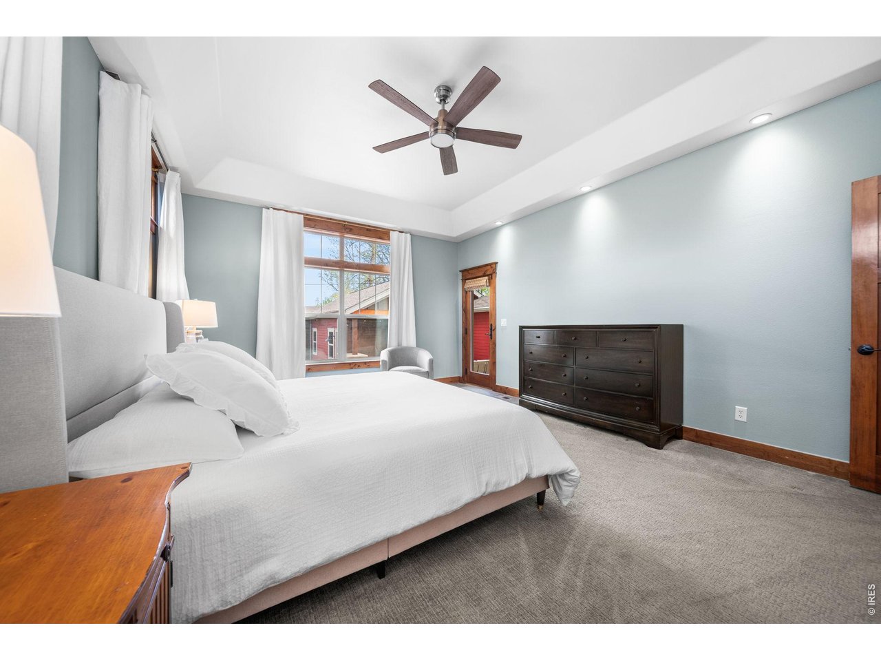 316 Wood Street Fort Collins, CO 80521 - Photo 22 of 50 a bedroom with a bed and a large window