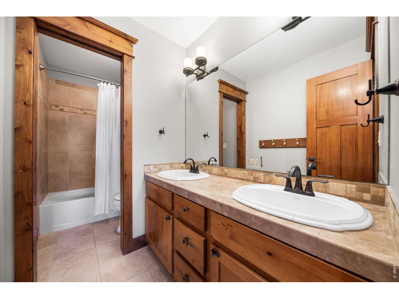 316 Wood Street Fort Collins, CO 80521 - Photo 34 of 50 a bathroom with a sink double vanity and a mirror