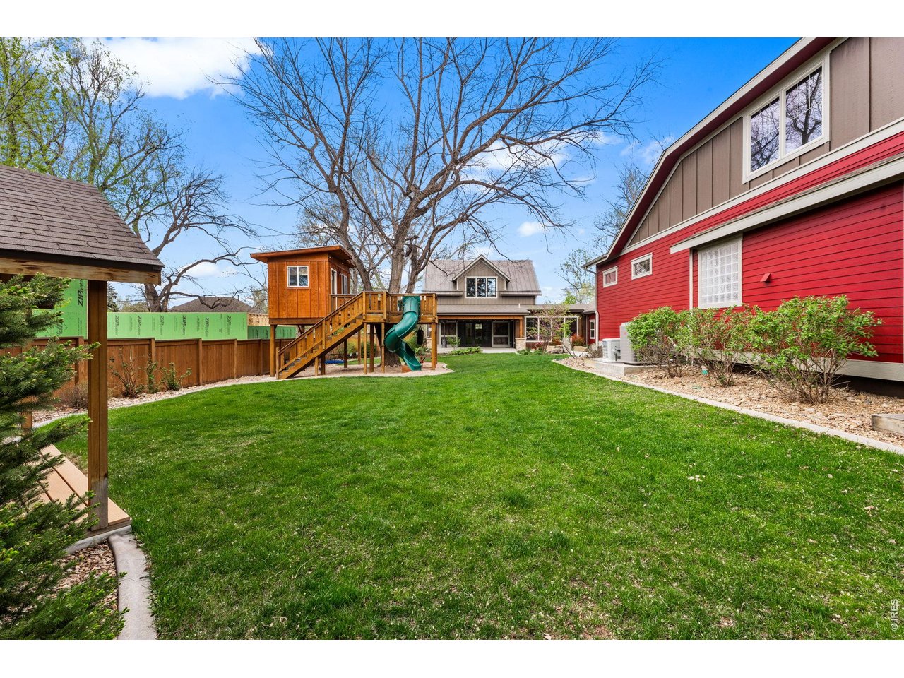 316 Wood Street Fort Collins, CO 80521 - Photo 45 of 50 a view of a house with a yard porch and sitting area