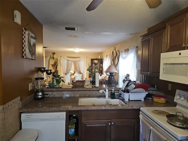 a kitchen with counter top space and sink
