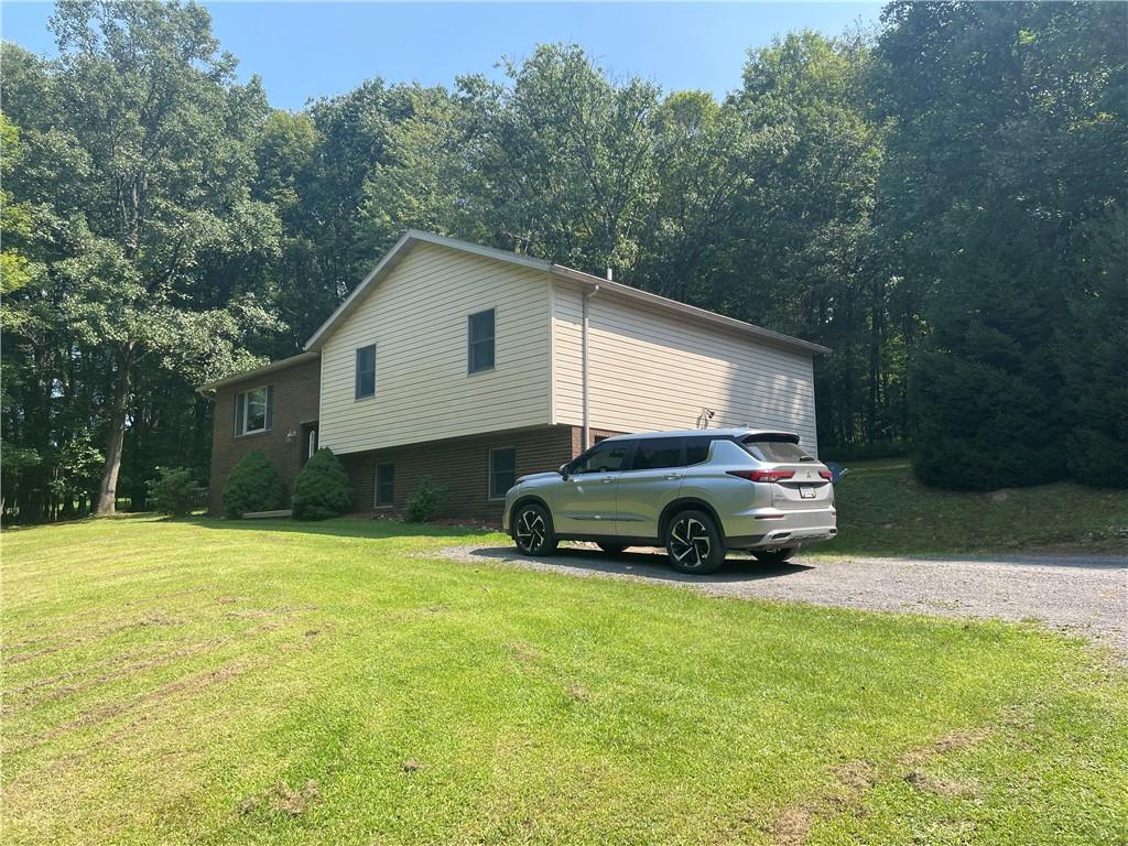 809 West Union Road West Lebanon, PA 15783 - Photo 4 of 25 a car parked in front of a house with a yard