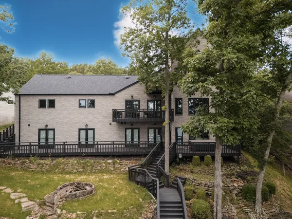 an aerial view of a house with yard
