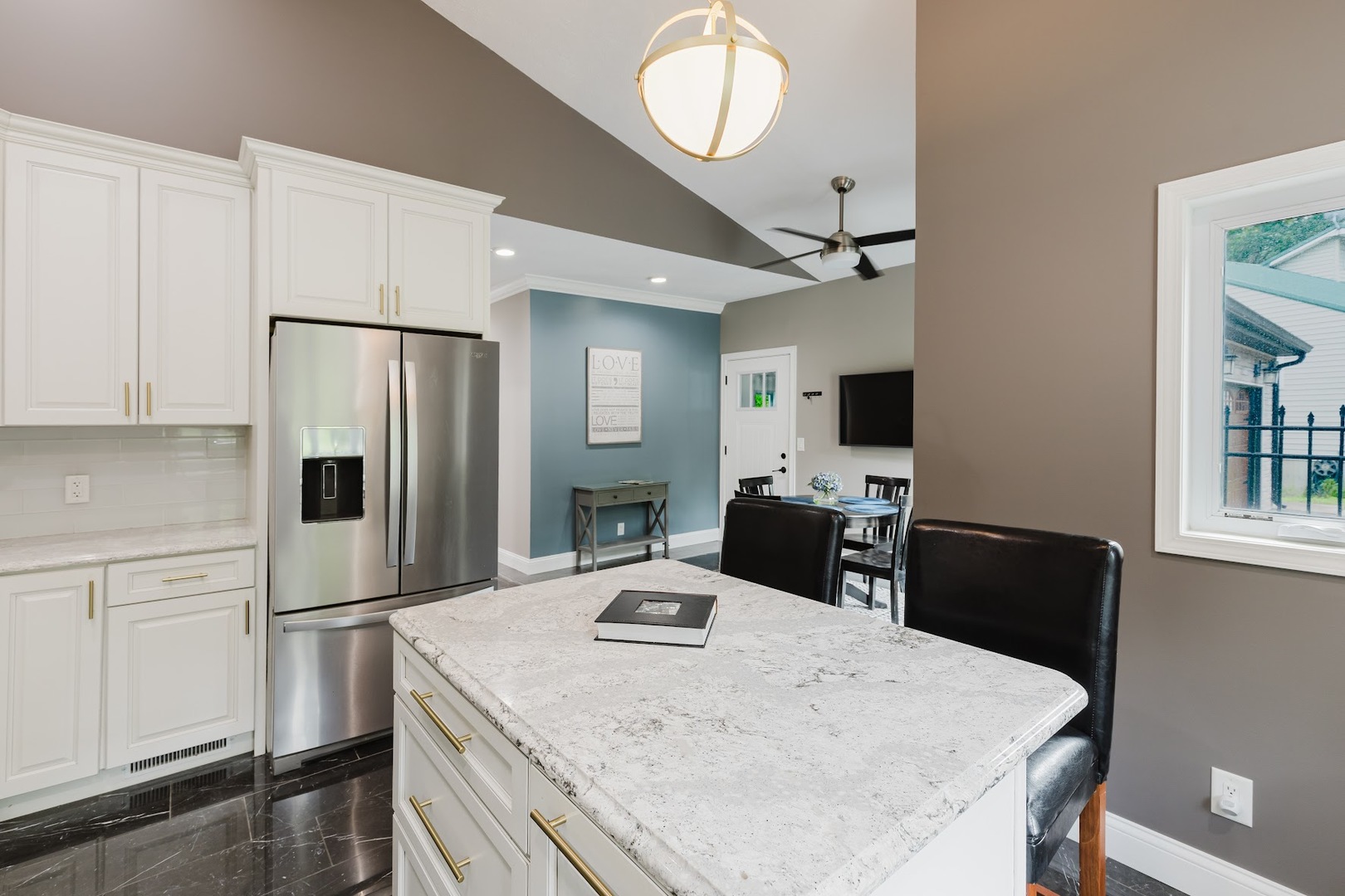 12225 Pebble Point Road Marion, IL 62959 - Photo 24 of 88 a kitchen with stainless steel appliances granite countertop a refrigerator a stove a microwave oven a sink dishwasher and white cabinets with wooden floor