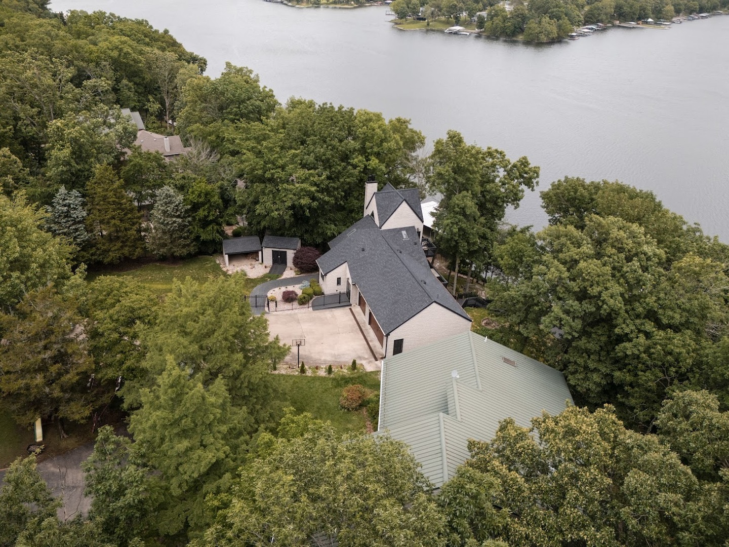 12225 Pebble Point Road Marion, IL 62959 - Photo 80 of 88 an aerial view of a house with a yard and lake view