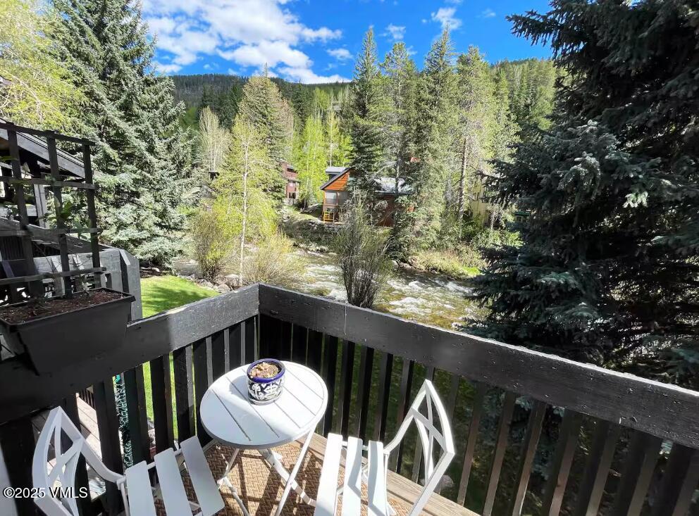 2958 South Frontage Road West, Unit B5 Vail, CO 81657 - Photo 12 of 13 a balcony with table and chairs