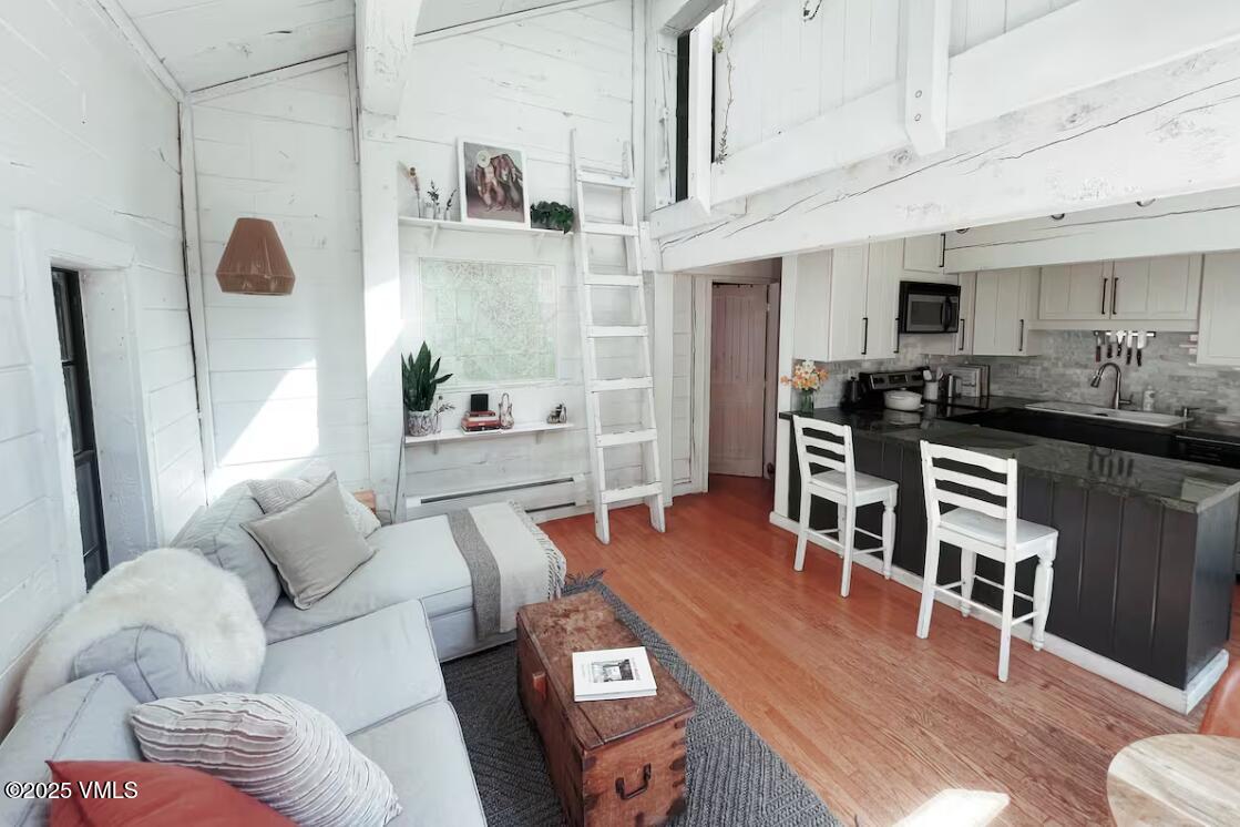 2958 South Frontage Road West, Unit B5 Vail, CO 81657 - Photo 2 of 13 a living room with furniture and wooden floor