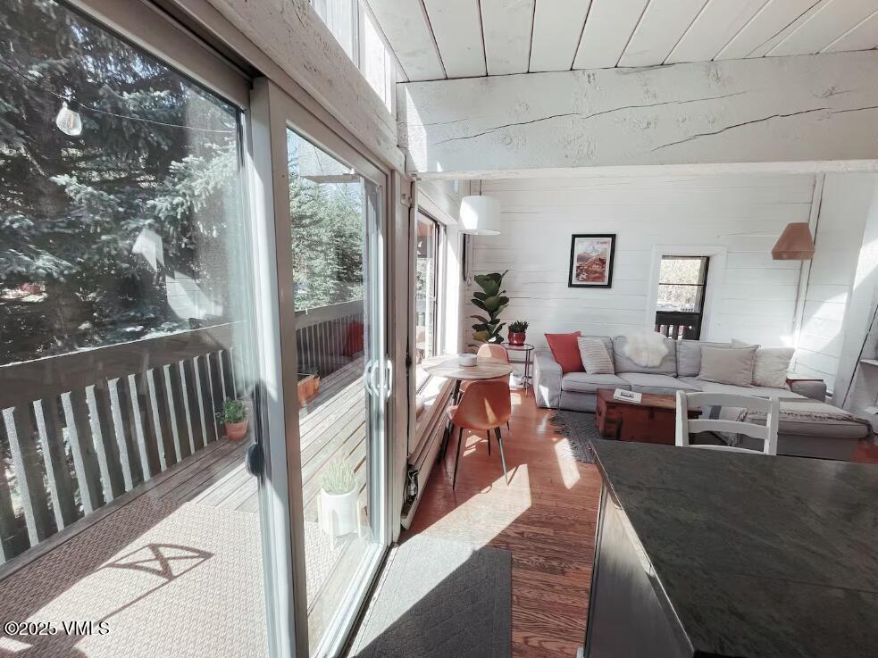 2958 South Frontage Road West, Unit B5 Vail, CO 81657 - Photo 6 of 13 a living room with furniture and a large window