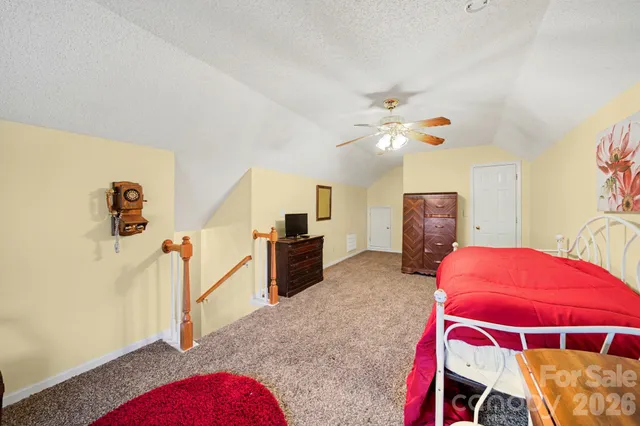 a livingroom with furniture and a flat screen tv
