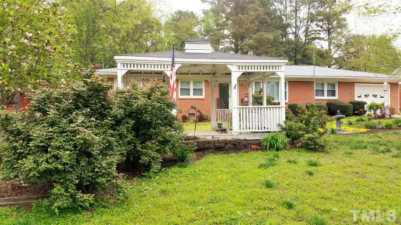 3809 Wester Road Raleigh, NC 27604 - Photo 22 of 24 a front view of a house with a yard