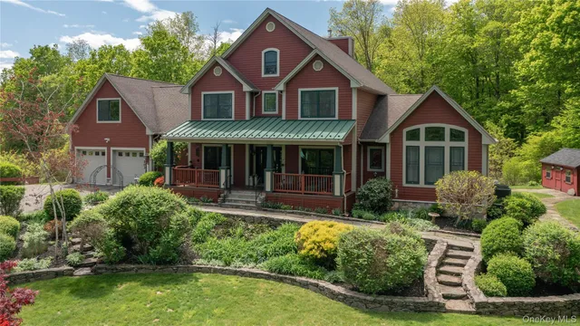 a front view of a house with a yard and porch