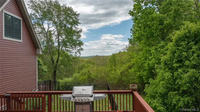 a balcony with wooden floor and fence