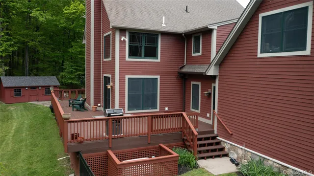 a balcony with table and chairs