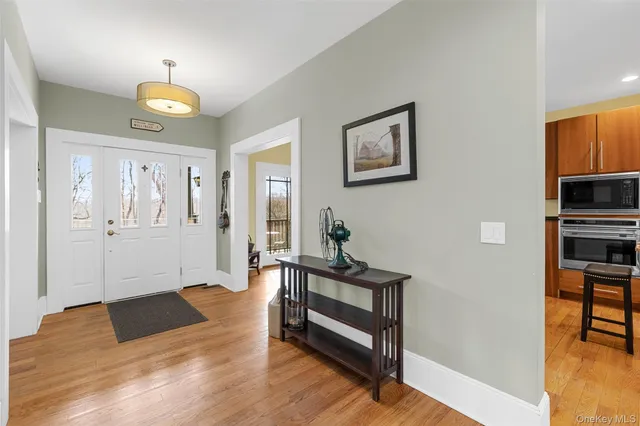 a view of a livingroom with furniture and wooden floor