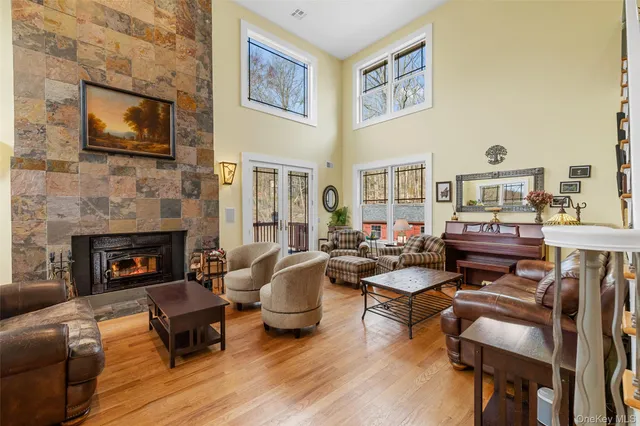a living room with furniture fireplace and a flat screen tv