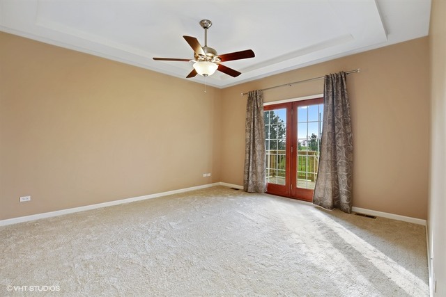 2309 Dean Street Sycamore, IL 60178 - Photo 12 of 25 a view of an empty room with chandelier fan and a window