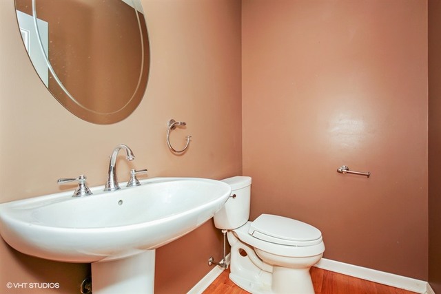 2309 Dean Street Sycamore, IL 60178 - Photo 14 of 25 a bathroom with a sink and a mirror