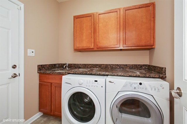 2309 Dean Street Sycamore, IL 60178 - Photo 15 of 25 a close view of a utility room with dryer and washer