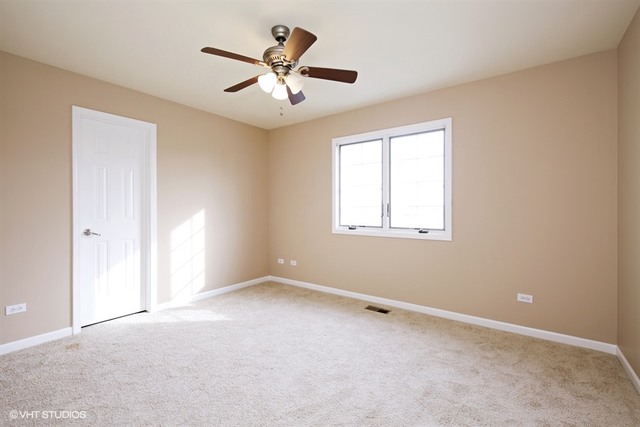 2309 Dean Street Sycamore, IL 60178 - Photo 18 of 25 an empty room with windows and fan