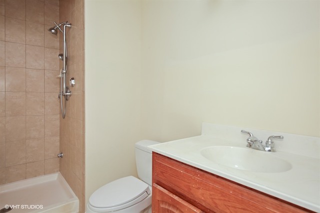 2309 Dean Street Sycamore, IL 60178 - Photo 23 of 25 a bathroom with a sink toilet and shower