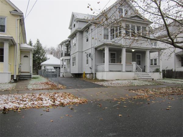 38-40 Palmyra Street Springfield, MA 01118 - Photo 1 of 14 a front view of a house with a yard