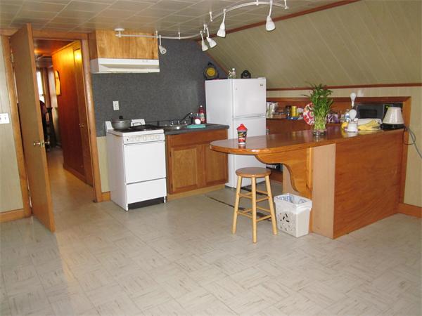 38-40 Palmyra Street Springfield, MA 01118 - Photo 12 of 14 a room with furniture a washer and dryer