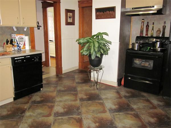 38-40 Palmyra Street Springfield, MA 01118 - Photo 2 of 14 a living room with furniture a flat screen tv and a fireplace