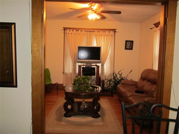 38-40 Palmyra Street Springfield, MA 01118 - Photo 4 of 14 a living room with furniture and a flat screen tv