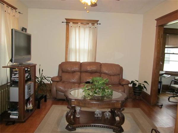 38-40 Palmyra Street Springfield, MA 01118 - Photo 5 of 14 a room with furniture and a flat screen tv