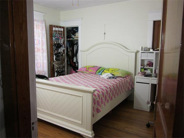 38-40 Palmyra Street Springfield, MA 01118 - Photo 7 of 14 a bedroom with a bed and a walk in closet