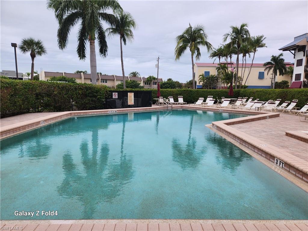 805 River Point Drive, Unit C307 Naples, FL 34102 - Photo 21 of 31 a view of swimming pool with lake view