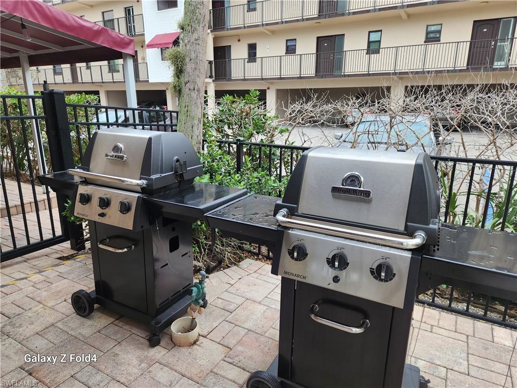 805 River Point Drive, Unit C307 Naples, FL 34102 - Photo 22 of 31 a white stove top oven sitting inside of a kitchen