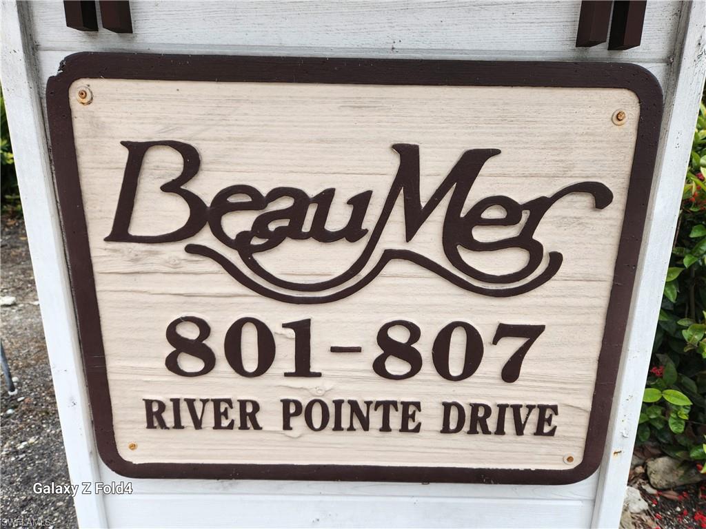 805 River Point Drive, Unit C307 Naples, FL 34102 - Photo 29 of 31 a close up of a street sign