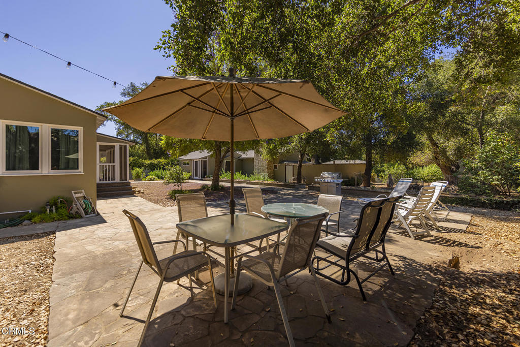 840 Fairview Road Ojai, CA 93023 - Photo 14 of 34 a view of patio with chairs and table under an umbrella