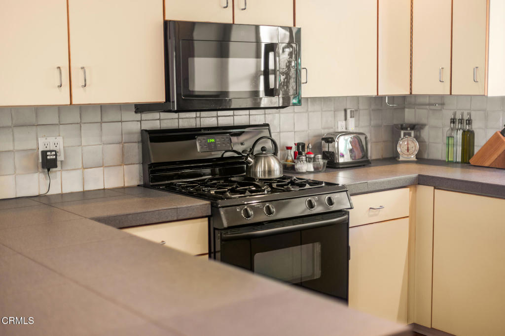 840 Fairview Road Ojai, CA 93023 - Photo 20 of 34 a kitchen with a stove and a sink