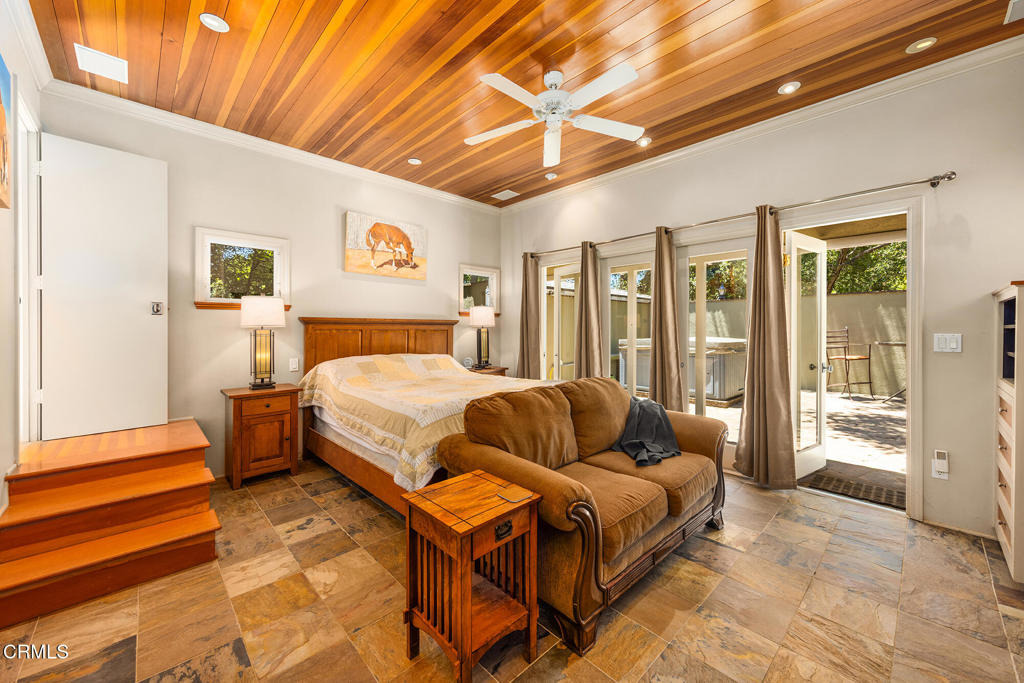 840 Fairview Road Ojai, CA 93023 - Photo 21 of 34 a spacious bedroom with a bed and glass door